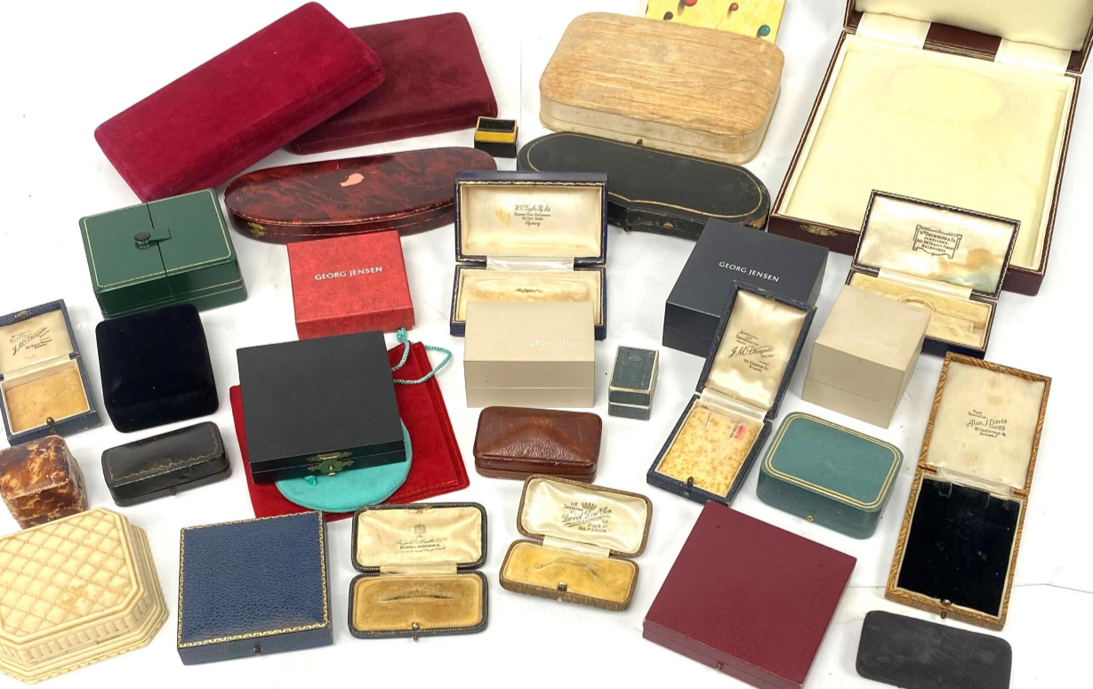 Collection of various jewelry boxes of different sizes on a white background.