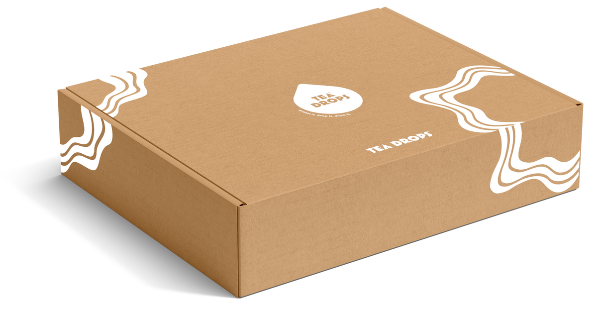 Tea Drops FSC-certified recycled paperboard mailer box with dividable insert holding compostable tea pouches