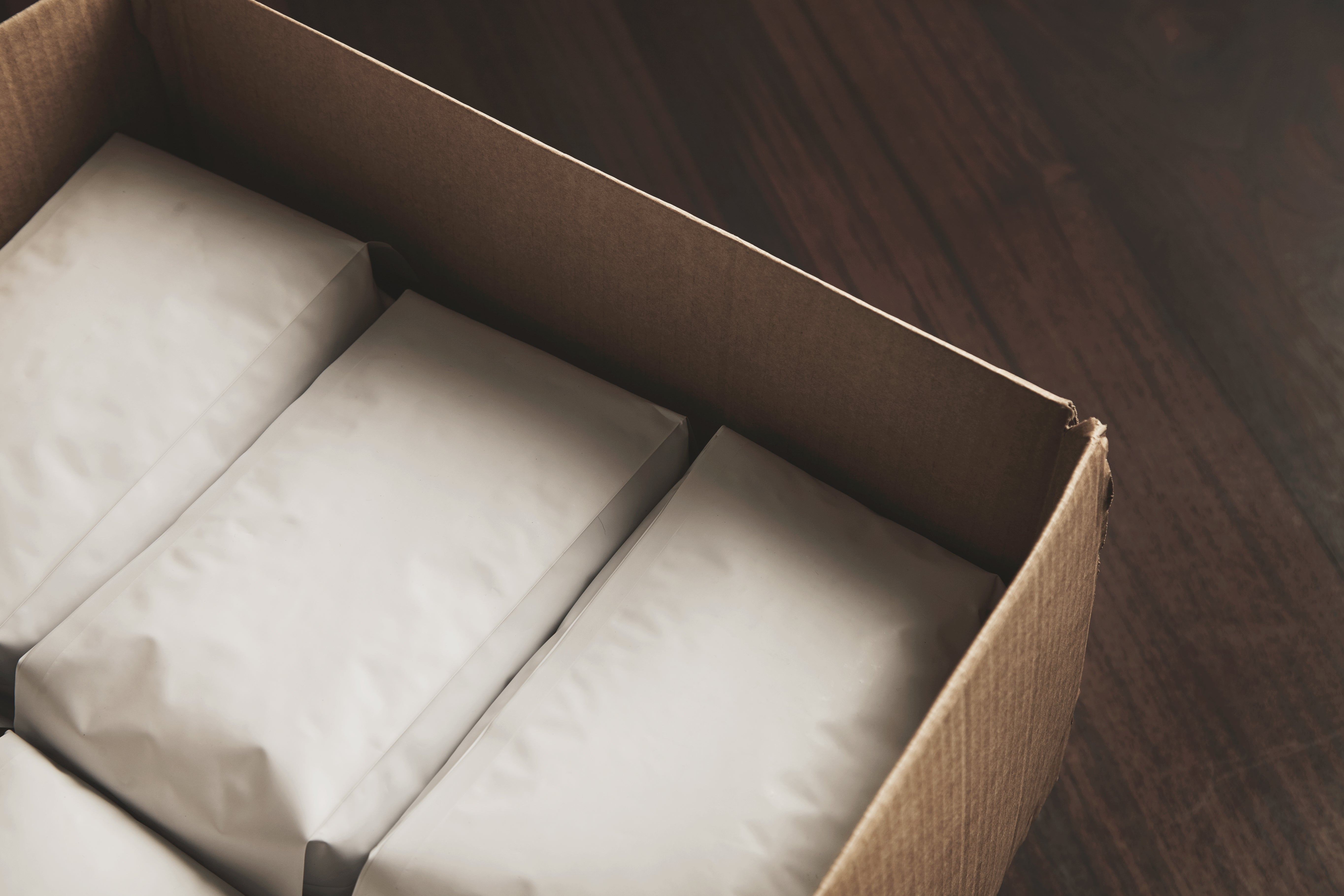 Opened carton box with empty space around packages